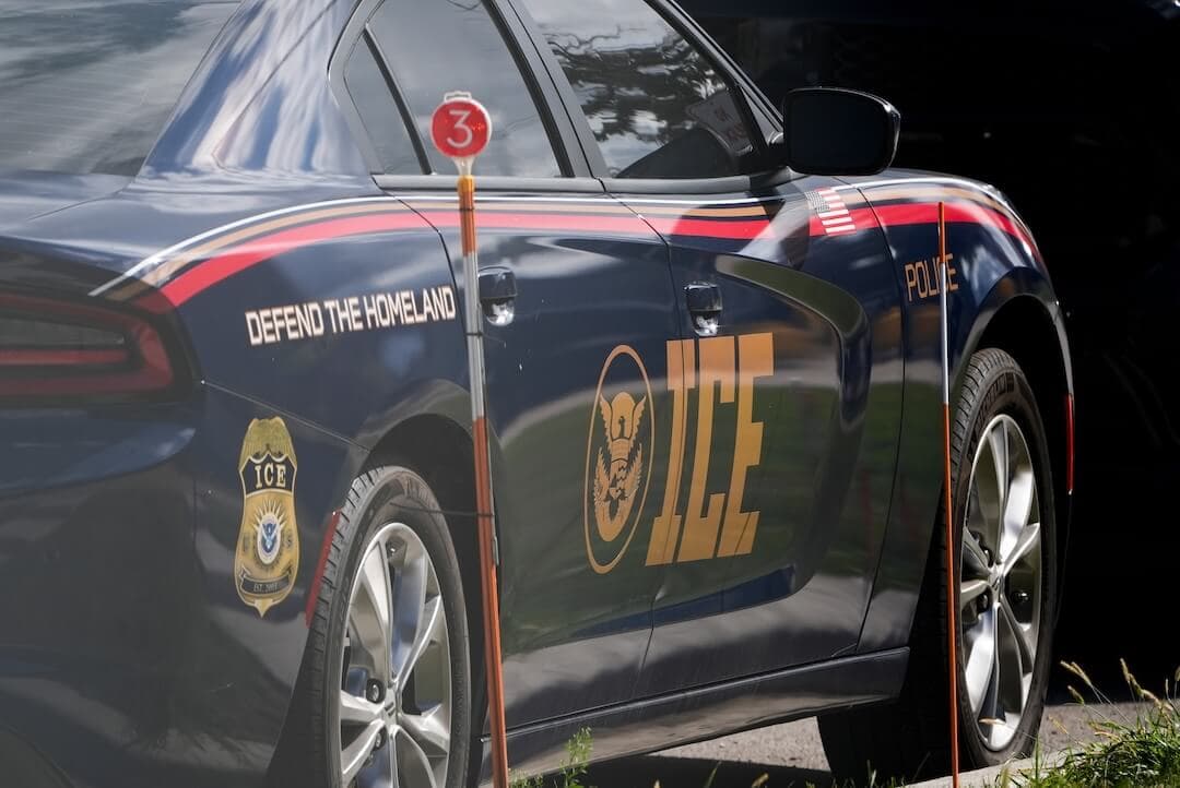 A popular video of a priest blocking ICE agents isn’t real